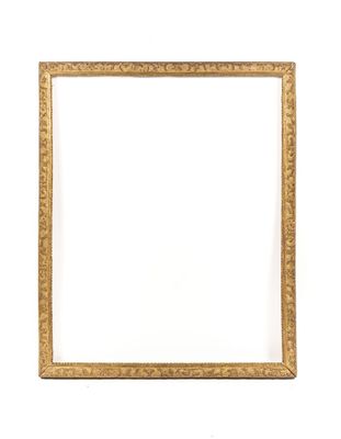 a gold picture frame on a white wall with a white background