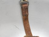 a piece of leather that has been pulled out of the toilet