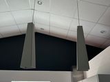 two lamps hanging from the ceiling in a room
