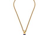 un collier en or avec un pendentif en pierre bleue, monté sur une chaîne en or