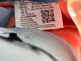 a close up of a person ' s shoe with a label on it