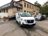 a white van that is parked in front of a building
