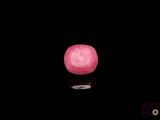 a pink apple that is glowing in the dark