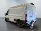a white van with a broken rear end in a room