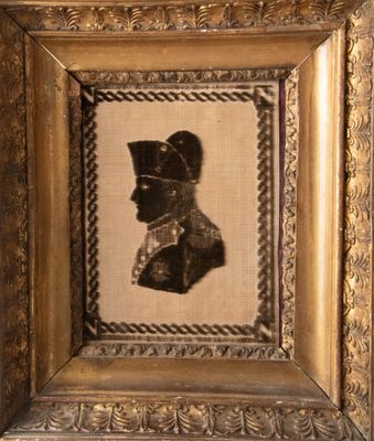 an old picture of a man in a military uniform in a gold frame