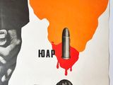 an image of a poster with a hand holding a bullet and a map of africa