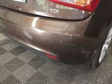 a close up of a car ' s tail light and bumper