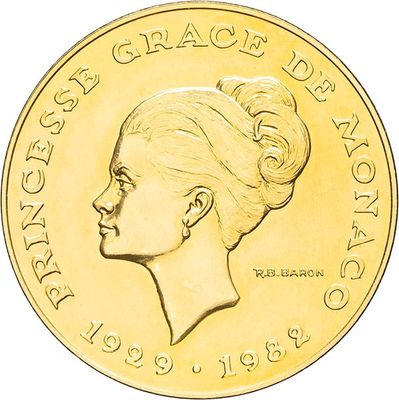 the gold coin has a profile of a woman ' s head on it