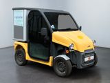 a small yellow and black vehicle parked in a room