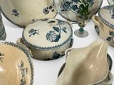 a lot of bowls and bowls that are sitting on a table