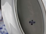 a white plate with a blue and white design on it