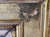 a picture of a gold frame with a mirror in it