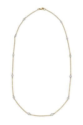 a gold and white necklace with diamonds