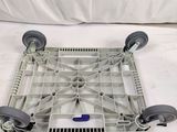 a dolly that is sitting on top of a white sheet