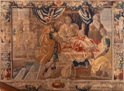 une tapisserie représentant un homme et une femme dans un lit