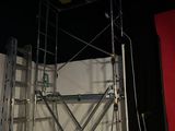 a picture of a scaffold with a clock on top of it
