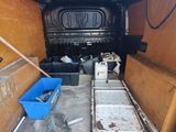 a van that has a lot of stuff in the back of it