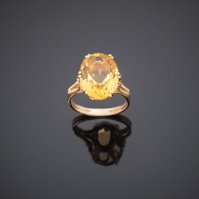 a yellow sapphire and diamond ring