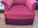 a red chair that is sitting in a room