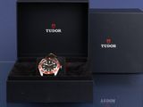 a black box with a red and black watch inside of it