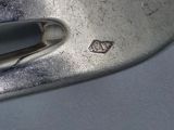 a close up of a metal object with a heart on it