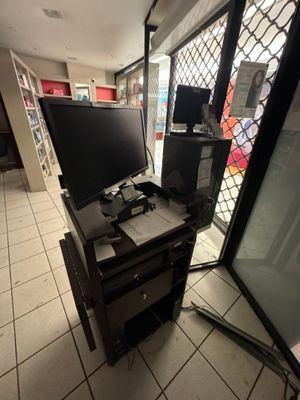 a computer desk with two monitors on top of it