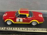 a red and yellow model of a car in a display case