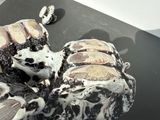 a cake that is sitting on a black table