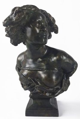 an image of a bronze busturine of a woman with curly hair