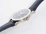 an image of a close up of a wrist watch on a white surface