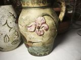 three vases that are sitting on a table