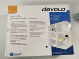 the box is open to show the contents of the device