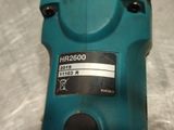 a close up of a blue electric drill on a table