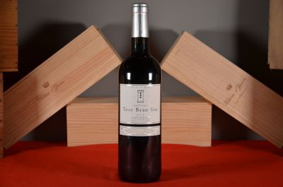 a bottle of wine that is sitting on a table
