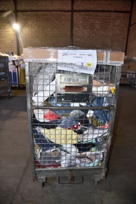 a metal cart with many items in it in a warehouse