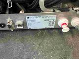 an image of a close up of a hose connected to a water heater