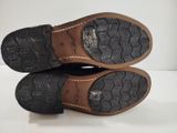 pair of brown leather shoes with black soles on a white surface