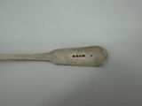 a wooden spoon with a metal handle on a white surface