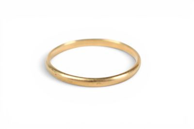 a close up of a gold ring on a white background