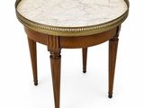 an image of a marble topped table with wooden legs