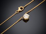 a gold chain with a diamond pendant on it