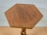 a small wooden table with a wooden top on a wooden floor