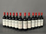 six bottles of red wine lined up in a row