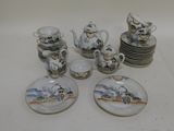 many plates and cups that are sitting on a table