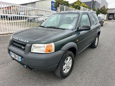 a picture of a green suv parked in a parking lot