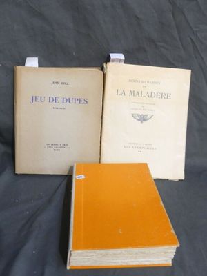 two books sitting on top of a table next to each other