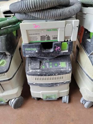 several dust machines are stacked on top of each other in a room