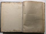 an open book on a table with a white background