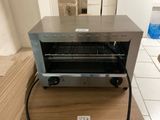 an image of a toaster oven on a table