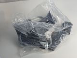 a plastic bag of food sitting on a table